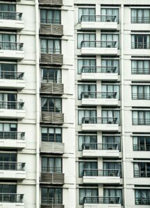 Detailed view of a modern condominium building with balconies in Jakarta, Indonesia.
