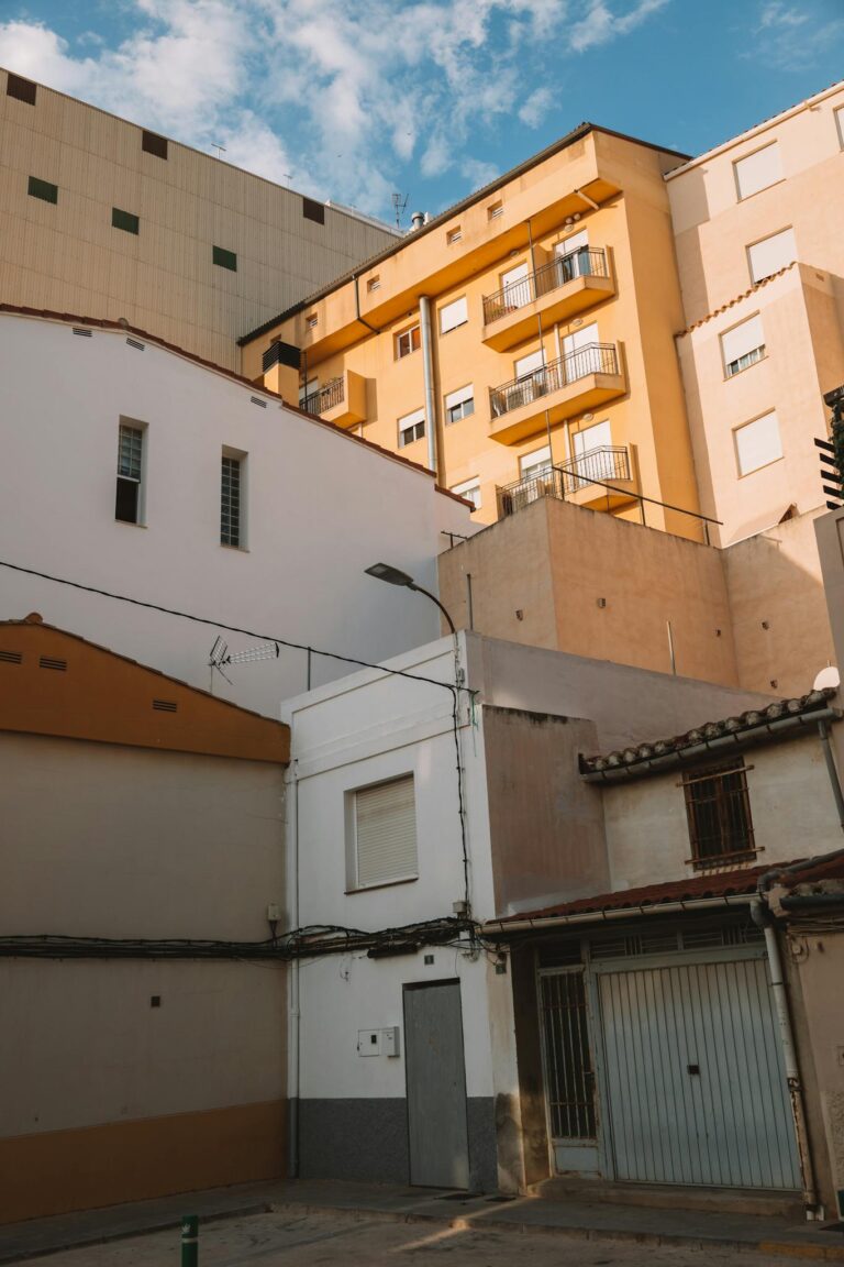 Low angle view of urban residential buildings in Valencia, Spain.